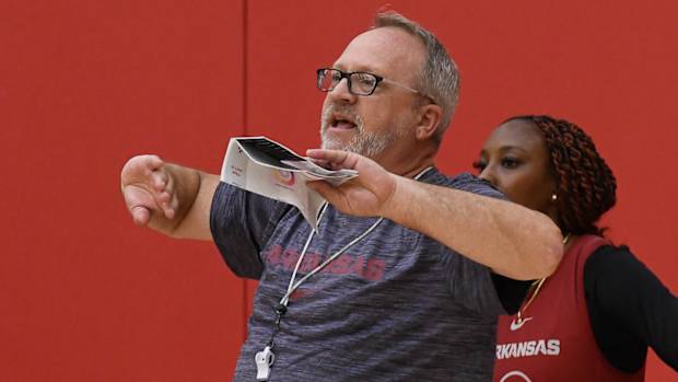 Razorbacks coach Mike Neighbors at practice Thursday before trip to Europe